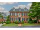 Beautiful two-story brick home with blue shutters and manicured front lawn at 3499 Paces Ferry Se Cir, Smyrna, GA 30080