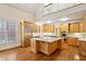 Bright kitchen featuring a large island, hardwood floors and stainless steel appliances at 3499 Paces Ferry Se Cir, Smyrna, GA 30080