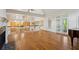 Open living room view shows the hardwood floors, fireplace and kitchen at 3499 Paces Ferry Se Cir, Smyrna, GA 30080