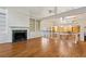 Open concept living room with hardwood floors, fireplace and view of the kitchen at 3499 Paces Ferry Se Cir, Smyrna, GA 30080