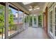 Enclosed porch with a fan, skylight, wood floors and lots of windows at 3499 Paces Ferry Se Cir, Smyrna, GA 30080
