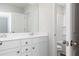 Bright bathroom featuring double sinks, white cabinets and an adjacent toilet at 407 Newland Way, Acworth, GA 30102