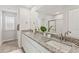 Bright bathroom with granite countertops, double sinks, and a glass-enclosed shower at 407 Newland Way, Acworth, GA 30102
