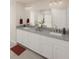 Bathroom featuring granite countertops, double sinks, and a glass-enclosed shower at 407 Newland Way, Acworth, GA 30102