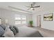 Spacious bedroom with a ceiling fan, natural light, and neutral decor at 407 Newland Way, Acworth, GA 30102