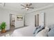 Light bedroom featuring a ceiling fan and access to both the bathroom and a closet at 407 Newland Way, Acworth, GA 30102