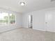 Bedroom with neutral carpet, windows, and entry to bathroom at 407 Newland Way, Acworth, GA 30102