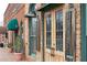 Close-up of historic brick building with decorative doors and green trim at 407 Newland Way, Acworth, GA 30102