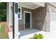 Close up of exterior entrance of home showcasing address plaque and brick facade at 407 Newland Way, Acworth, GA 30102
