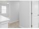 Hallway featuring carpet, a light fixture, and a view of another room at 407 Newland Way, Acworth, GA 30102