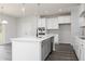 Spacious kitchen island featuring quartz countertops and stainless steel appliances at 407 Newland Way, Acworth, GA 30102