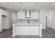Modern kitchen with white cabinetry, quartz countertops, and stainless steel appliances at 407 Newland Way, Acworth, GA 30102