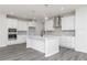 Modern kitchen with white cabinetry, quartz countertops, and stainless steel appliances at 407 Newland Way, Acworth, GA 30102