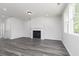 Comfortable living area with fireplace, neutral color palette and ample natural light at 407 Newland Way, Acworth, GA 30102