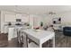 New living space featuring an open kitchen and dining area with seating and modern appliances at 407 Newland Way, Acworth, GA 30102