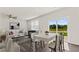New living space featuring an open concept with a kitchen, dining area, and large sliding doors at 407 Newland Way, Acworth, GA 30102
