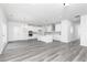 Open living space with eat-in kitchen, stainless appliances, and backyard access at 407 Newland Way, Acworth, GA 30102