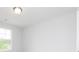 White room with a light fixture and large window at 407 Newland Way, Acworth, GA 30102