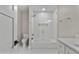 Bright bathroom featuring a shower-tub combo with white subway tile and hexagon tile flooring at 1066 Fairway Valley Dr, Woodstock, GA 30189