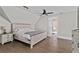 Bedroom featuring a hardwood floor, neutral wall colors and a ceiling fan at 1066 Fairway Valley Dr, Woodstock, GA 30189