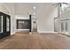 Spacious living area with hardwood floors, tall ceilings, and stylish modern lighting at 1066 Fairway Valley Dr, Woodstock, GA 30189