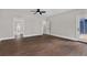 Spacious main bedroom with hardwood flooring, and access to back deck and bathroom at 1066 Fairway Valley Dr, Woodstock, GA 30189