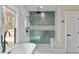 Modern shower with glass enclosure, and seating at 1066 Fairway Valley Dr, Woodstock, GA 30189