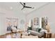 Sunlit living room with neutral decor, hardwood floors, and balcony access at 1836 Memorial Dr # 303, Atlanta, GA 30317