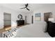 Spacious main bedroom with hardwood floors, ceiling fan, and walk-in closet at 1836 Memorial Dr # 303, Atlanta, GA 30317