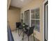 Inviting outdoor balcony featuring a small table and chairs, perfect for relaxing and enjoying the view at 1850 Cotillion Dr # 4218, Atlanta, GA 30338