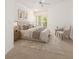 Serene bedroom with a large window, plush bedding, and a cozy seating area at 1850 Cotillion Dr # 4218, Atlanta, GA 30338