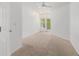 Bedroom with neutral carpet and access to a private balcony with natural light at 1850 Cotillion Dr # 4218, Atlanta, GA 30338