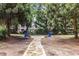 Charming common area with stone path and comfortable blue Adirondack chairs at 1850 Cotillion Dr # 4218, Atlanta, GA 30338