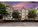 Stunning exterior view of a modern building with balconies and lush landscaping at 1850 Cotillion Dr # 4218, Atlanta, GA 30338