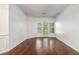 Living room with hardwood floors, decorative trim, and balcony with lots of light at 1850 Cotillion Dr # 4218, Atlanta, GA 30338