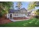 Expansive backyard featuring a spacious deck, lush lawn, and privacy fence at 4856 Saddlerun Ln, Powder Springs, GA 30127
