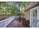 Inviting deck with a dining table and chairs, perfect for outdoor entertaining at 4856 Saddlerun Ln, Powder Springs, GA 30127