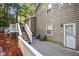 Outdoor patio adjacent to an elevated wooden deck for outdoor enjoyment at 4856 Saddlerun Ln, Powder Springs, GA 30127
