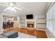 Cozy living room with fireplace and dining area at 4856 Saddlerun Ln, Powder Springs, GA 30127