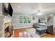 Inviting living room features hardwood floors and a fireplace at 4856 Saddlerun Ln, Powder Springs, GA 30127
