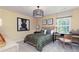 Sun-filled bedroom with a work space, modern decor, and a cozy atmosphere for relaxation and productivity at 608 Belshire Dr, Acworth, GA 30102