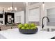 Bright kitchen with a large island, pendant lighting, modern sink fixture, and open view of dining and Gathering room at 608 Belshire Dr, Acworth, GA 30102