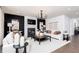 Contemporary living room showcases modern lighting, a cozy fireplace, and sophisticated decor accents at 608 Belshire Dr, Acworth, GA 30102