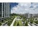 Beautiful aerial view of a park-like setting with modern buildings and a water feature, enhanced by clear blue skies at 3481 Lakeside Ne Dr # 1103, Atlanta, GA 30326