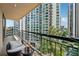 Relaxing balcony with seating and city views from a high-rise building at 3481 Lakeside Ne Dr # 1103, Atlanta, GA 30326