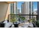 Comfortable balcony with seating and city views from a high-rise apartment at 3481 Lakeside Ne Dr # 1103, Atlanta, GA 30326