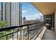 Condo balcony with metal railing offering city views and an outdoor seating area at 3481 Lakeside Ne Dr # 1103, Atlanta, GA 30326