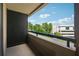 View from the balcony with black metal railing overlooking trees at 3481 Lakeside Ne Dr # 1103, Atlanta, GA 30326
