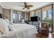 Bright bedroom boasts floor-to-ceiling windows, a ceiling fan, and balcony access at 3481 Lakeside Ne Dr # 1103, Atlanta, GA 30326