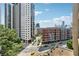 Urban view from the balcony featuring modern buildings and streetscape at 3481 Lakeside Ne Dr # 1103, Atlanta, GA 30326